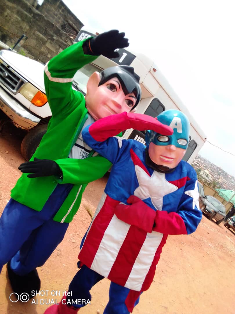 Ben 10 and Captain America character mascots posing together