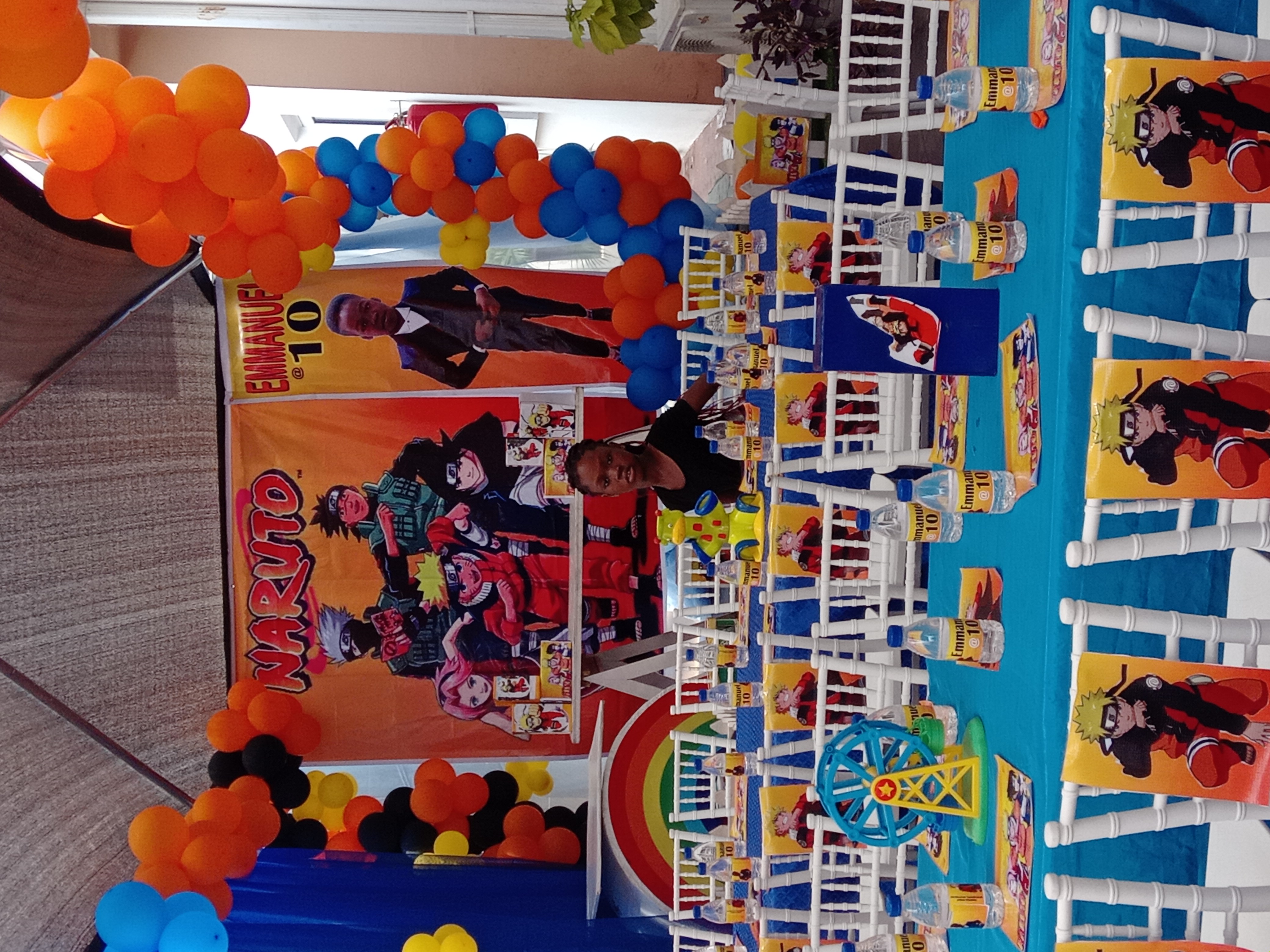 Naruto-themed party with blue tables and colourful balloon columns